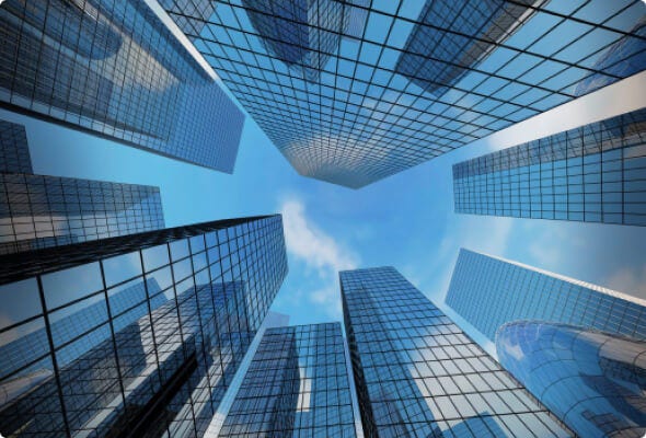 Worm’s eye view of modern skyscrapers and a blue sky 